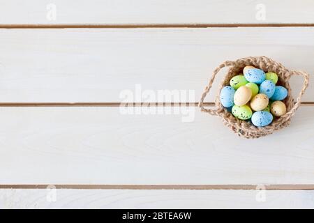 Basket with Easter eggs. Nest for eggs. handmade toy. Stock Photo
