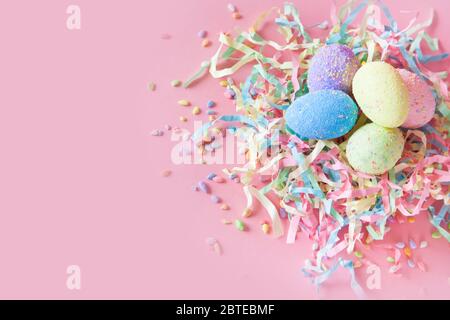 Gingerbread Easter bunny in Russian cake. Painted eggs. Orthodox Russian Easter. Pink background. Stock Photo