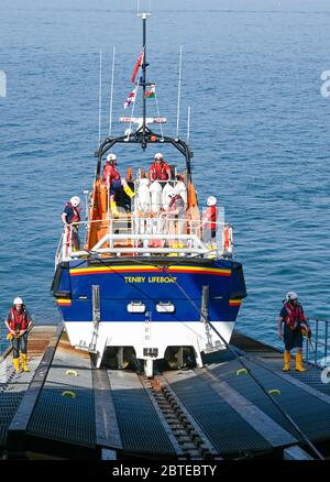 Tenby,Wales,UK - April 15 2019 : The Tenby Lifeboat returning to the station after a call out. Stock Photo