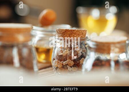 Glass jar of sweetener on wooden table Stock Photo
