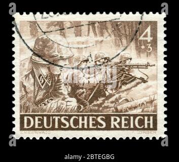 German historical stamp: Machine gunners of the elite division of the Wehrmacht Waffen-SS with machine gun mg-34, memorial day issue 1943, germany Stock Photo