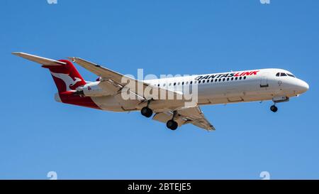 QantasLink Fokker F100 VH-NPU on approach to Perth Airport, Western Australia Stock Photo