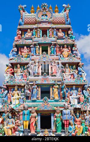 The gopuram (temple entrance tower) of Sri Mariammam Temple, South Bridge Road, Chinatown, Singapore, decorated with numerous figures of Hindu deities Stock Photo
