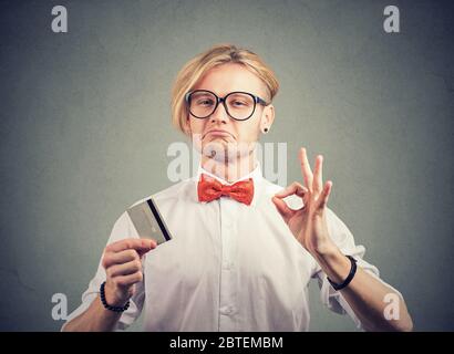 Sly liar salesman reassuring their credit card is the best Stock Photo