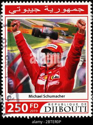 Michael Schumacher celebrating a victory on postage stamp Stock Photo