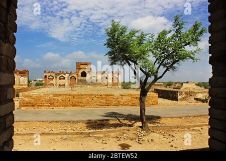 A beautiful view of tomb from a wall in a wall - Makli graveyard, Sindh, Pakistan Stock Photo