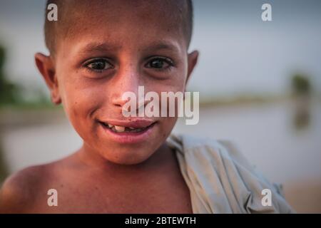 Portrait Of A Village Boy, Smiling And Looking At Camera In Sindh, Moro, Pakistan 26/08/2017 Stock Photo