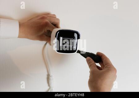 Installation of CCTV camera for home security. Videcam, smart home technology Stock Photo