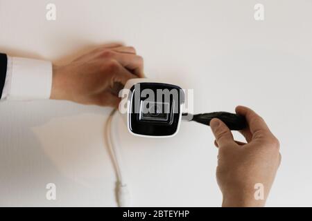 Installation of CCTV camera for home security. Videcam, smart home technology Stock Photo