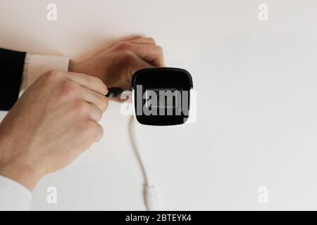 Installation of CCTV camera for home security. Videcam, smart home technology Stock Photo