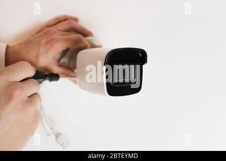 Installation of CCTV camera for home security. Videcam, smart home technology Stock Photo