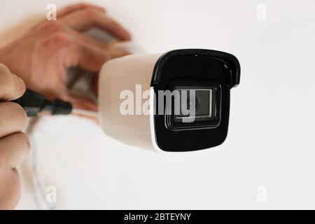 Installation of CCTV camera for home security. Videcam, smart home technology Stock Photo