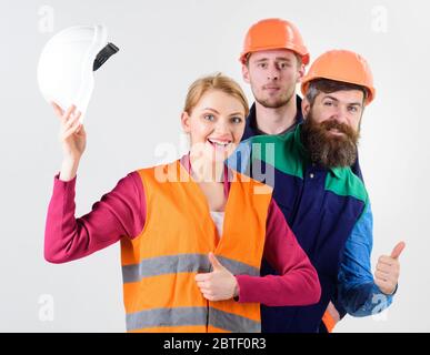 Woman and men holds hard hats. Best team concept. Team of builders ...