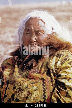 Early 1970s elderly Eskimo woman from the Kotzebue Sound region wearing ...