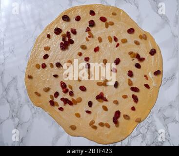 Process of cooking Easter cake cruffin, decorated with dried fruit and nuts. Stock Photo