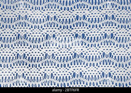 old-fashioned crochet lace pattern on blue background Stock Photo