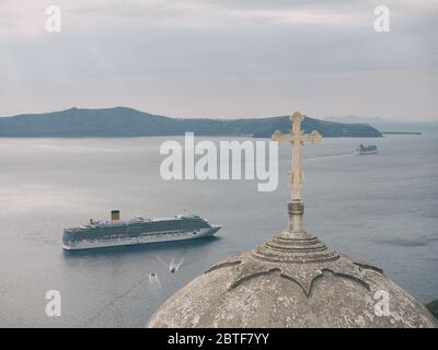 SANTORINI, GREECE- APRIL 12, 2017:Big cruise ship close to the shore of Santorini island, Greece Stock Photo