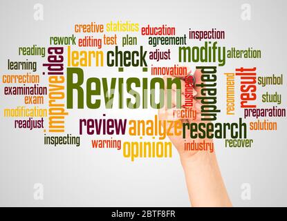 Revision word cloud and hand with marker concept on white background. Stock Photo