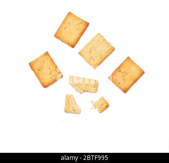 Some pieces of square multi grain baked crackers isolated on white background, top view Stock Photo