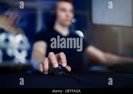 Close up of hands gamer playing in the video game using keyboard and mouse Stock Photo
