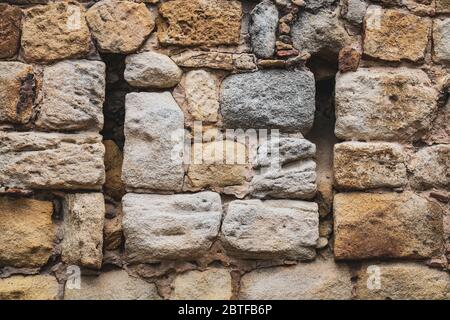 Historical stone wall built with natural calcareous rocks-blocks Stock Photo