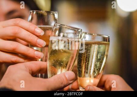 Friends clinking glasses with rose wine at Christmas, square crop stock  photo (222245) - YouWorkForThem