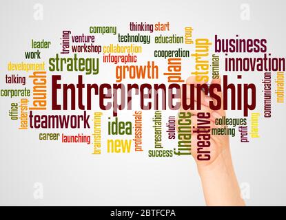 Entrepreneurship word cloud and hand with marker concept on white background. Stock Photo