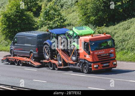Auto transporter, car transporter carrier; Motorway heavy bulk Haulage delivery trucks, haulage, lorry, transportation, collection and deliveries, truck, special cargo, Iveco vehicle, delivery, transport, industry, freight on the M6 motorway. Stock Photo
