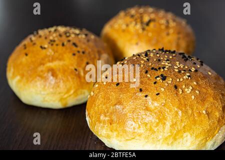 Group of three whole homemade burger bun Stock Photo