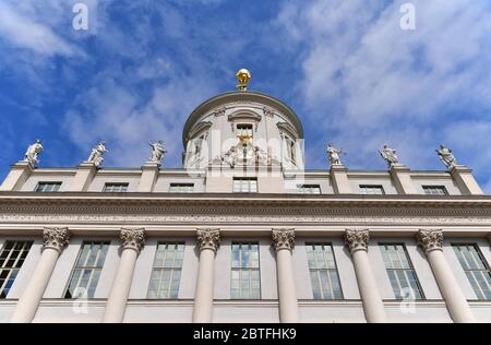 Potsdam, Germany. 18th May, 2020. The figure of Atlas stands on the roof of the Old Town Hall on the Old Market Square. The 650 kilogram bronze atlas had been restored and newly gilded by the Berlin restorer Ignaszenwski and has been standing in its old place again since December 2008. Credit: Soeren Stache/dpa-Zentralbild/ZB/dpa/Alamy Live News Stock Photo