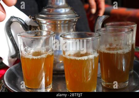 Traditional Moroccan Green Tea with Mint at small town in the Atlas Mountains in Morocco Stock Photo
