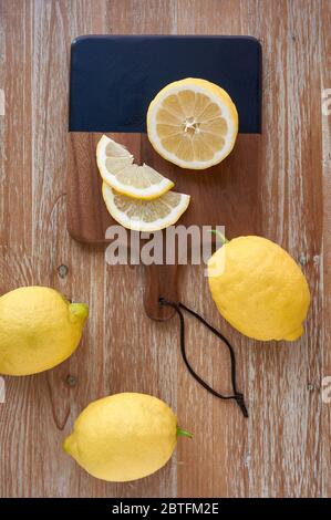 Top view of 3 lemons on rustic wooden table Stock Photo