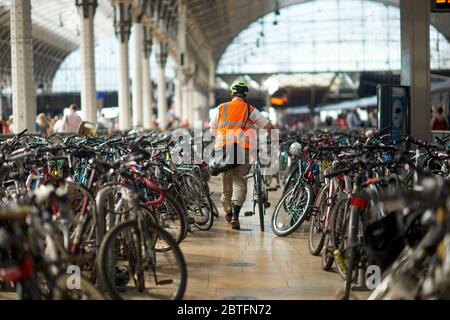 bike and people in the train station waiting the owners Stock Photo