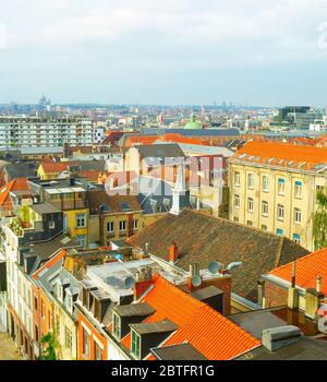 Aerial view of oldtown architecture with red tiled rooftops and modern cityscape in background, Brussels, Belgium Stock Photo