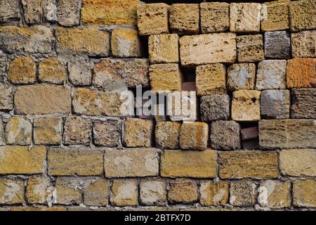 a shadow from the blocks of limestone shell. Wall texture background Stock Photo
