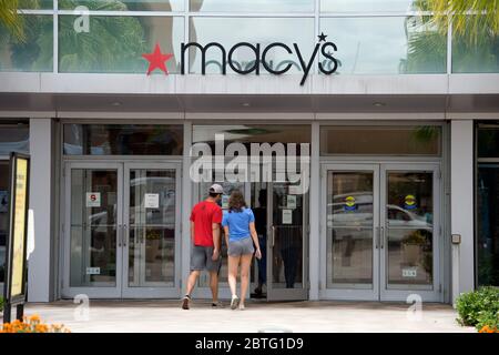 Wesley Chapel, FL, USA. 24th May, 2020. Shoppers visit a MacyÃs Department Store store at Wiregrass Mall in Wesley, Chapel, Florida. The company, is slated to close more than 100 under-performing stores nationwide in a cost-cutting strategy. Credit: Robin Rayne/ZUMA Wire/Alamy Live News Stock Photo