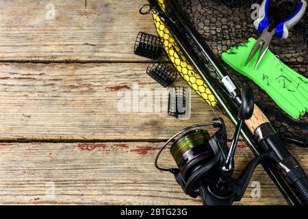 Fishing tackle - fishing spinning, fishing line, hooks and lures on wooden  background. Top view. Copy space. Still life Flat lay Stock Photo - Alamy