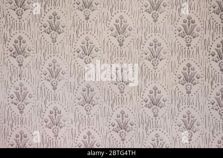 Retro style floral ornament background on the old wall. Stock Photo