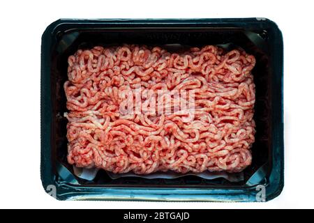 Raw minced meat on a plastic black plate, white isolated background Stock Photo