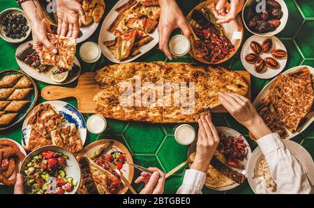 Muslim Ramadan iftar family dinner with Turkish foods and ayran Stock Photo