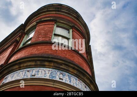Building detail with cloudy sky background Stock Photo