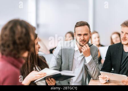 close up. brooding entrepreneur sitting at office Desk Stock Photo