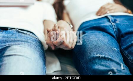 image of a young couple lying on the floor in the living room. Stock Photo