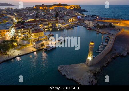 RETHIMNO - GREECE, OCTOBER 26, 2019: Aerial view of Rethymno city in Crete illuminated late in the afternoon Stock Photo