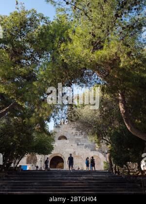 ATHENS - GREECE, JUNE 22, 2018: Tourists visit the Odeon of Herodes Atticus in Athens, Greece Stock Photo