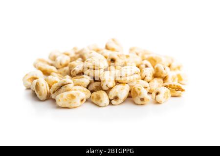 Puffed wheat covered with honey isolated on white background. Stock Photo