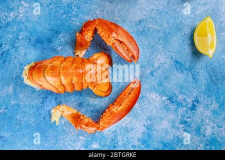 Tasty seafood served on table with boiled lobster on lemon dinner Stock Photo