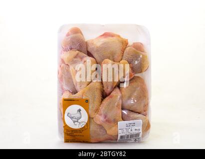Alberton, South Africa - fresh raw uncooked chicken portions from Woolworths Food isolated on a clear background image with copy space Stock Photo