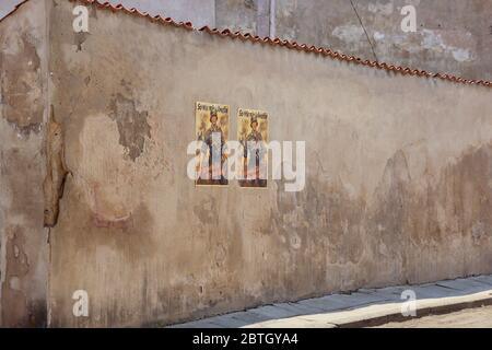 World War II era Nazi, German military posters on an old, stucco wall. The posters are set dressing for a WWII era film for the Russian market. In Vil Stock Photo