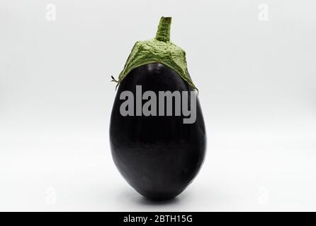 One fresh eggplant, or aubergine vegetable isolated on white background Stock Photo